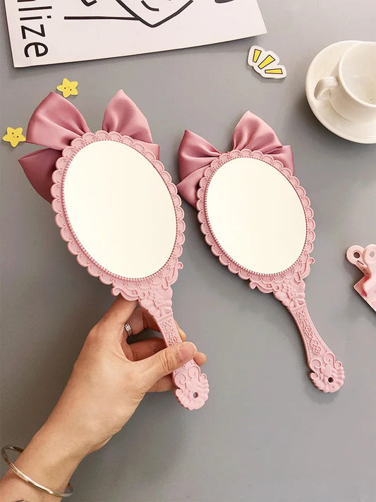 TSHOU632 Cute bowknot creative handle makeup mirror hand-held beauty salon makeup princess mirror portable mirror Pink color